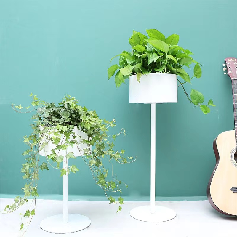 A Nordic-style flower stand beside the TV cabinet in the living room, a single floor-standing light luxury display item, and a green plant stand indoors Item Picture