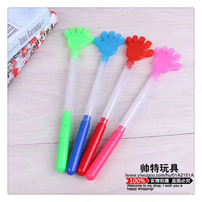 Clapping hands with flashing sticks to support the bar, listening to music to add to the fun, and lighting toys details Picture