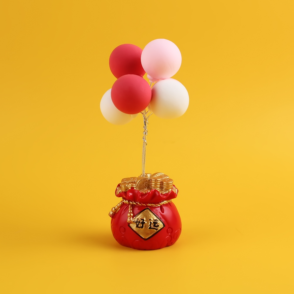 Factory wholesale of lucky bags, confession balloons, Douyin, the same style of car ornaments, good luck home resin handicrafts and ornaments Application Scenario