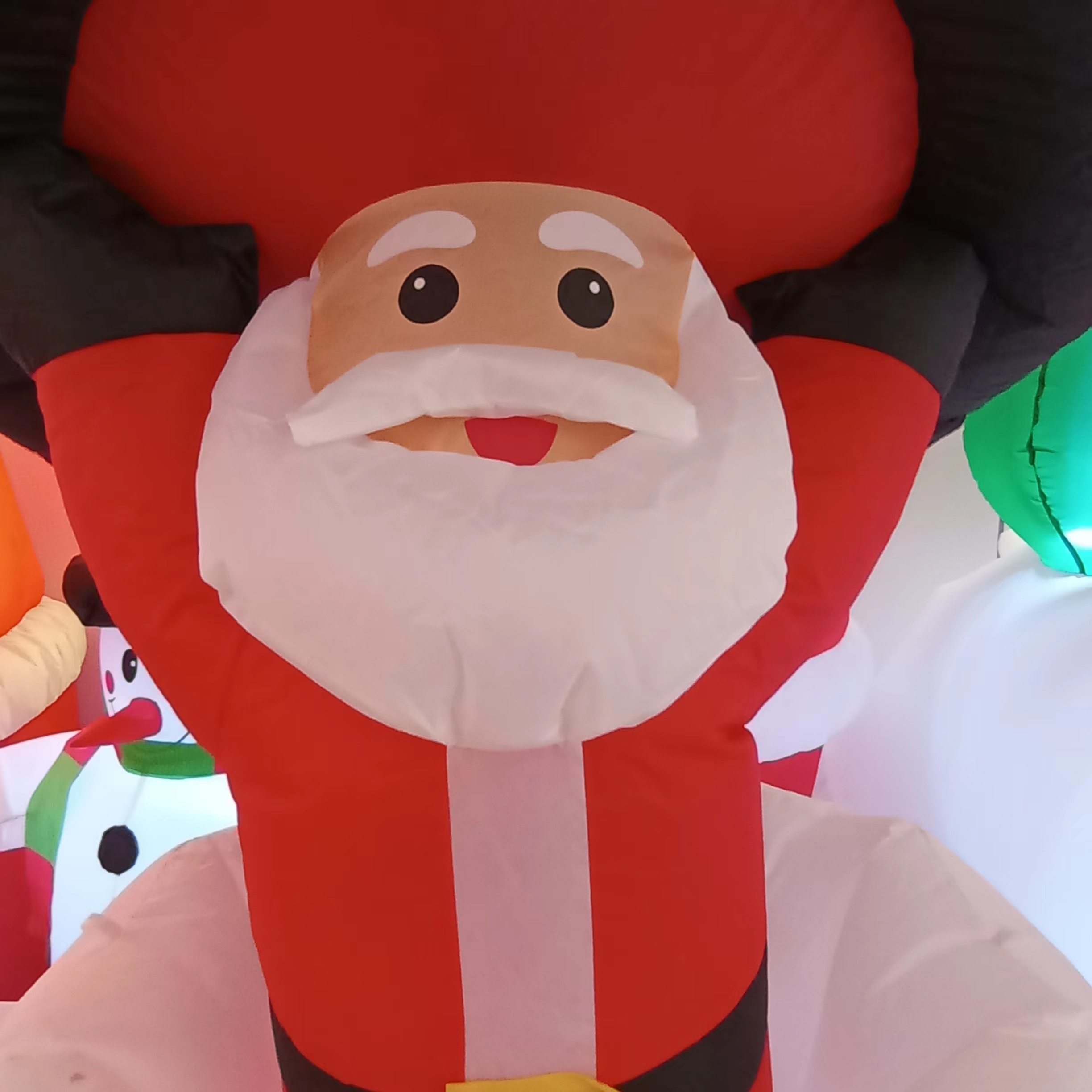 Christmas air Model 9123 features a snowman that can move up and down and Santa Claus holding a hat as a Christmas decoration