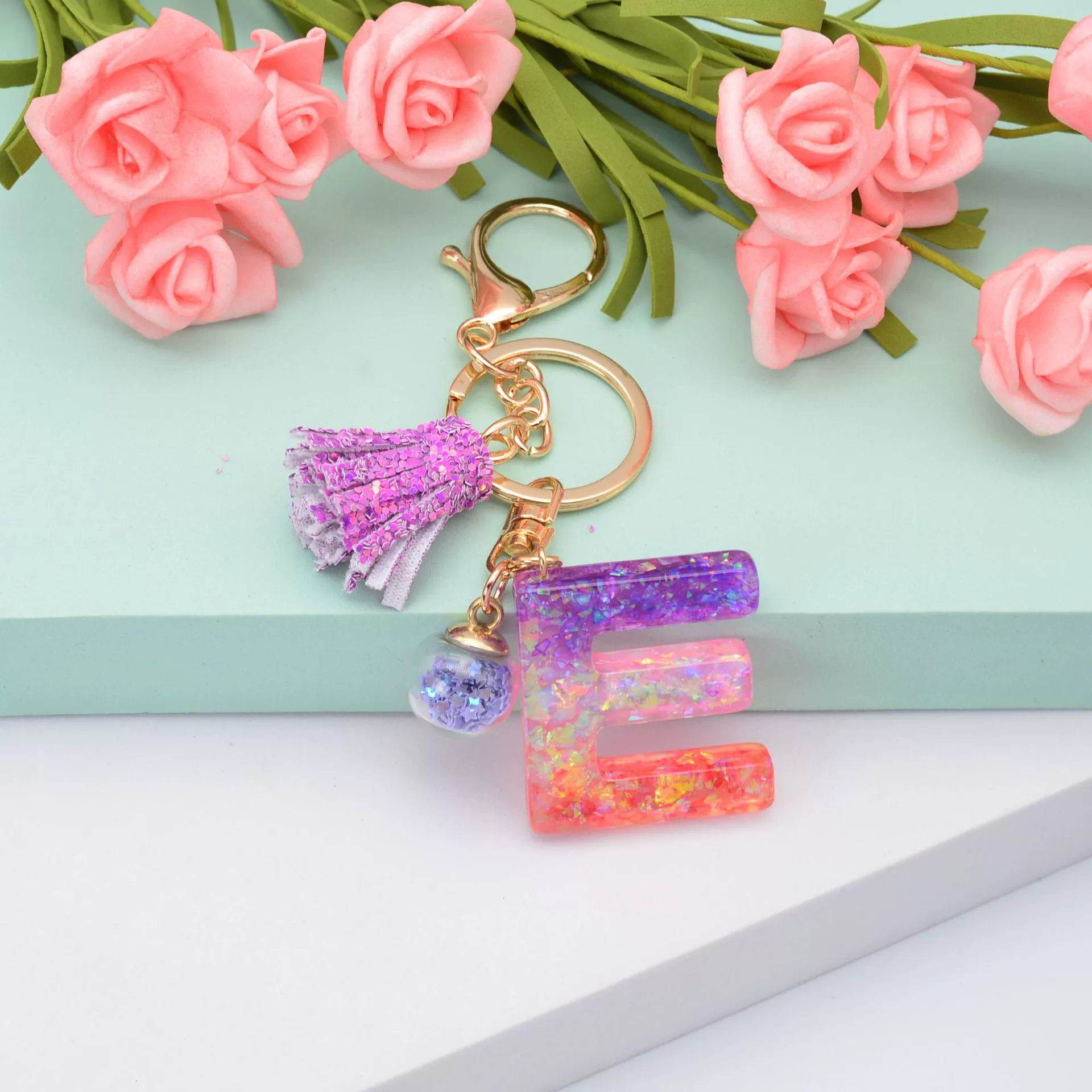新款闪粉流苏字母钥匙扣水晶滴胶紫色葱粉挂件女士包包小礼品配饰  87详情图10