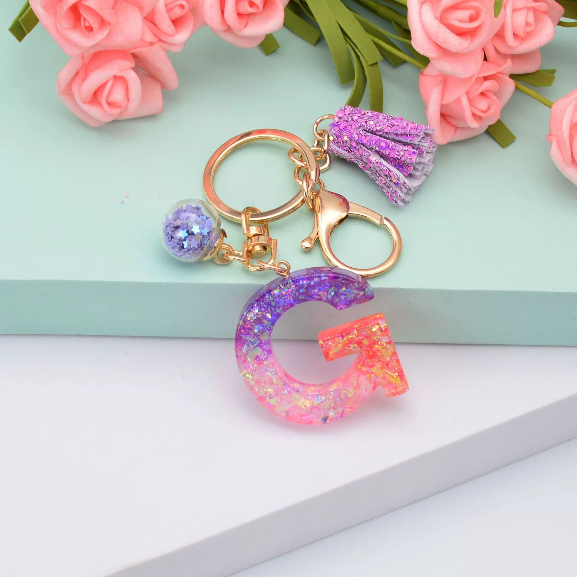新款闪粉流苏字母钥匙扣水晶滴胶紫色葱粉挂件女士包包小礼品配饰  87详情图7