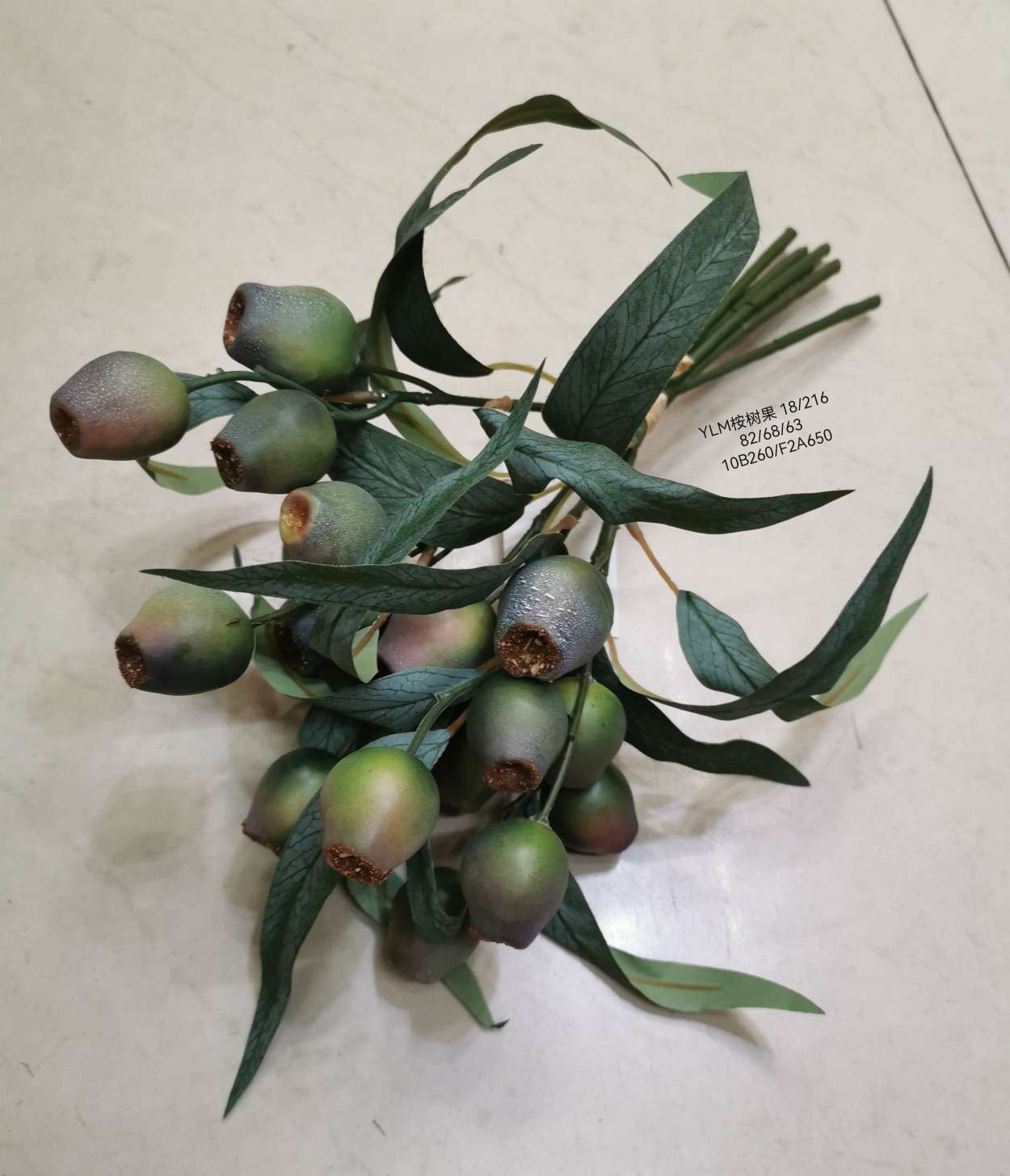 Wedding video: The bride holds a bouquet of flowers and makes a bouquet. Home decoration: living room, conference hall, hotel lobby. Realistic hand-made eucalyptus fruits are placed detail image 4