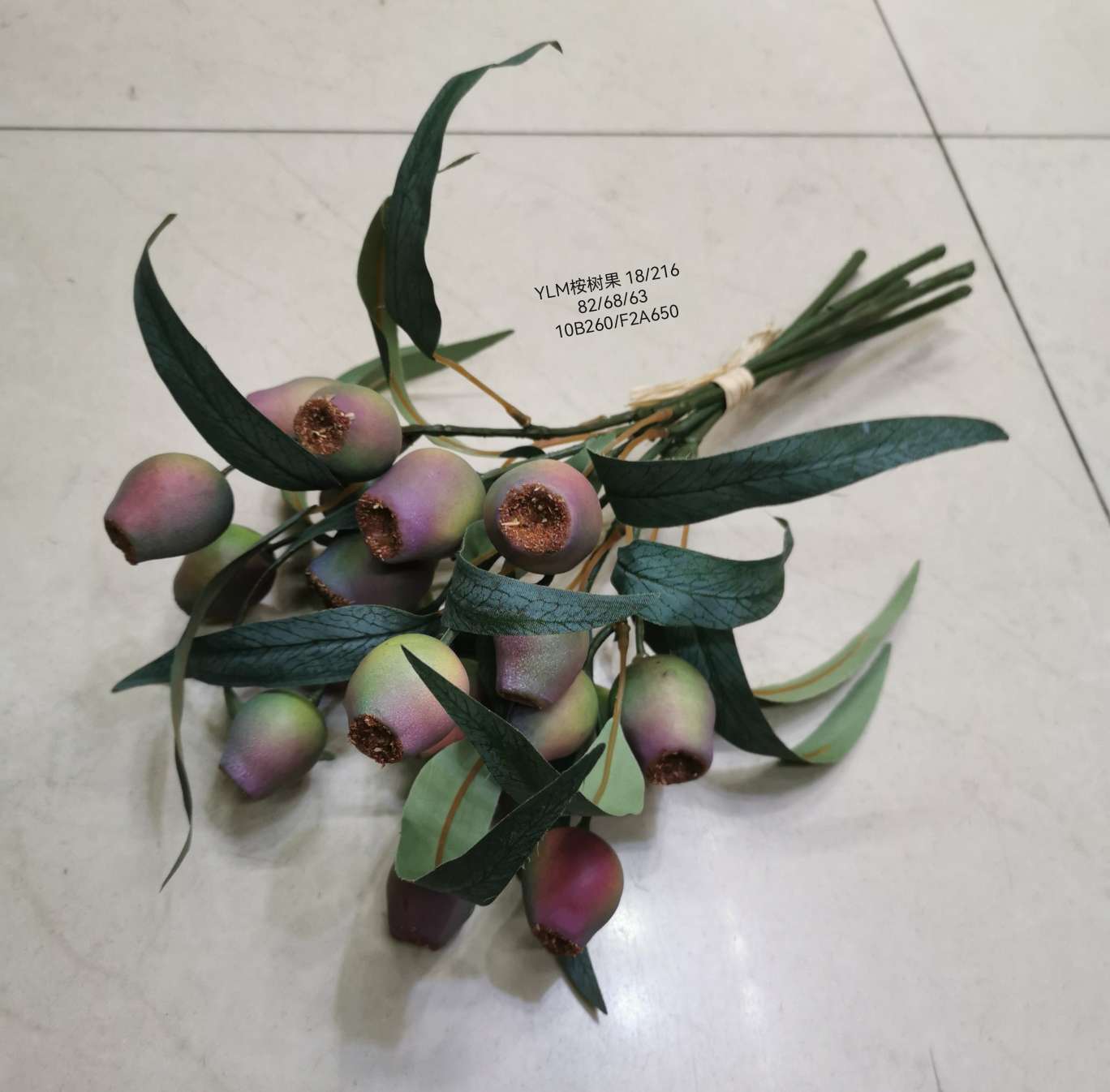 Wedding video: The bride holds a bouquet of flowers and makes a bouquet. Home decoration: living room, conference hall, hotel lobby. Realistic hand-made eucalyptus fruits are placed detail image 5
