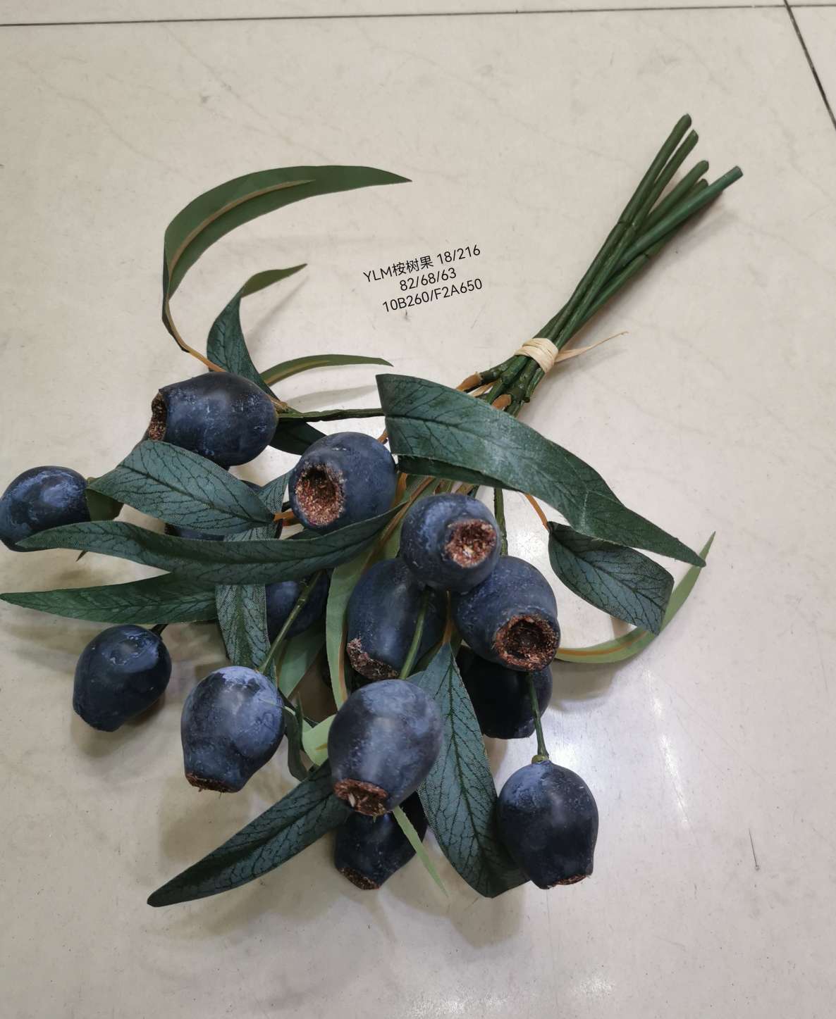 Wedding video: The bride holds a bouquet of flowers and makes a bouquet. Home decoration: living room, conference hall, hotel lobby. Realistic hand-made eucalyptus fruits are placed detail image 6