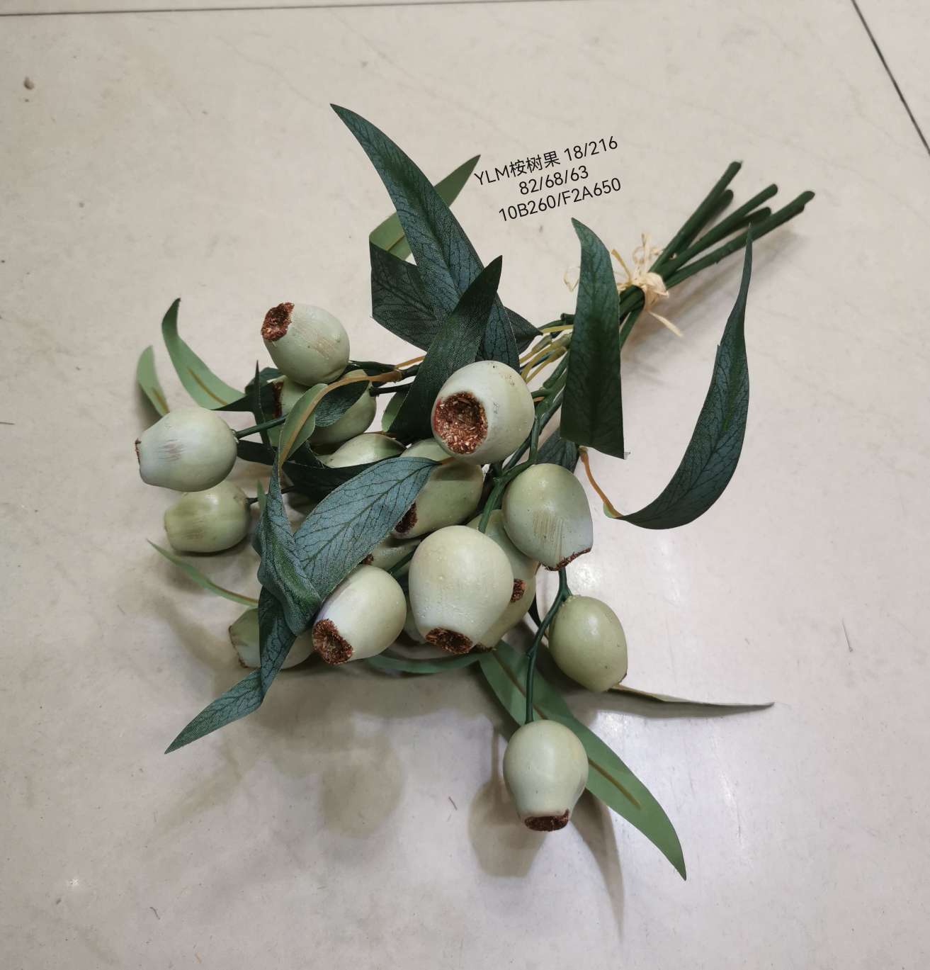 Wedding video: The bride holds a bouquet of flowers and makes a bouquet. Home decoration: living room, conference hall, hotel lobby. Realistic hand-made eucalyptus fruits are placed detail image 3