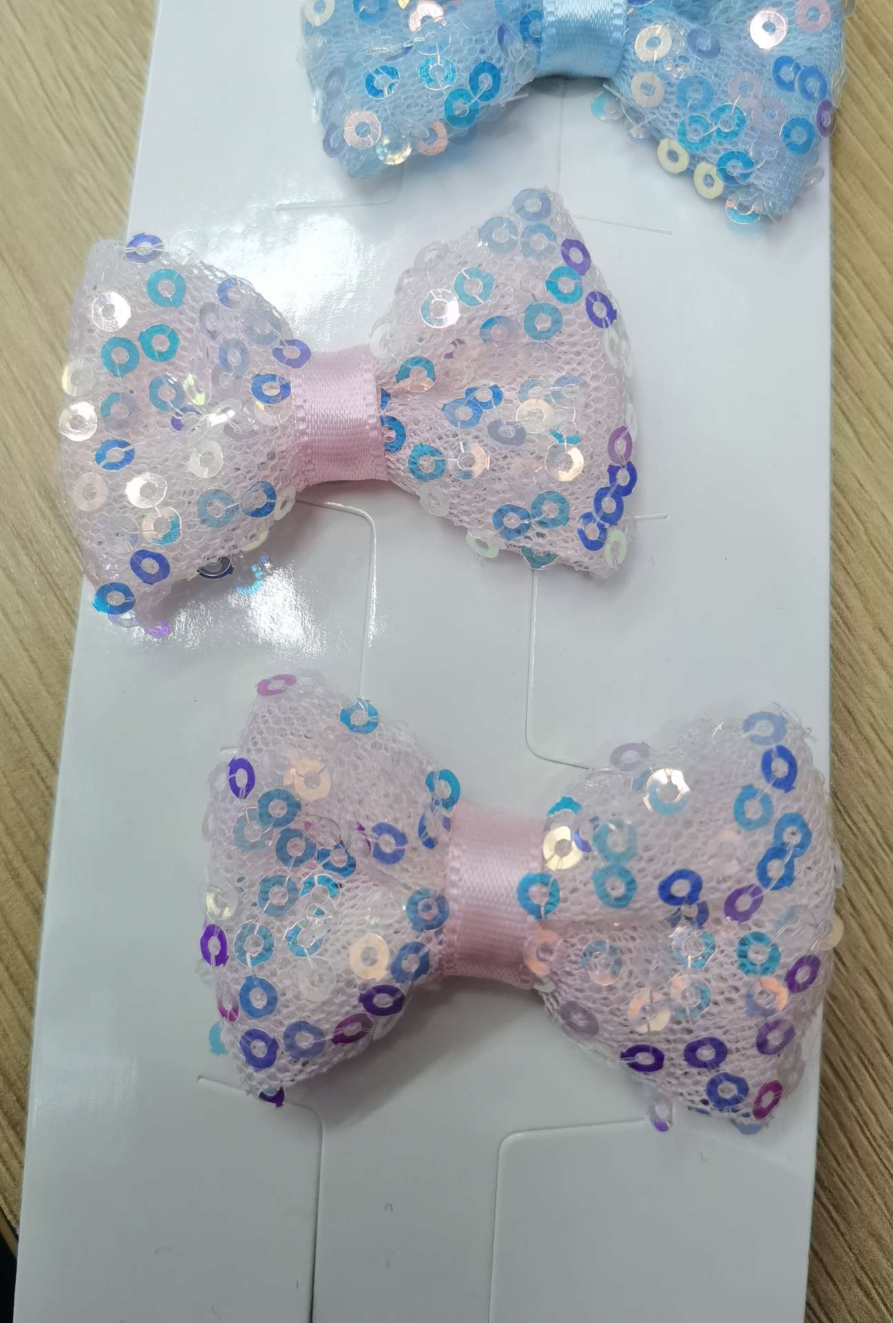 Sequined mesh bow