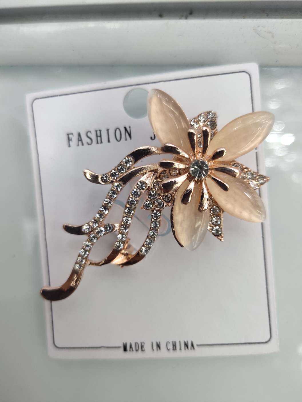 韩版猫眼水钻似水流年胸针