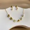 A unique and versatile style gold bean natural pearl 18K gold-plated titanium steel necklace collarbone chain Application Scenario