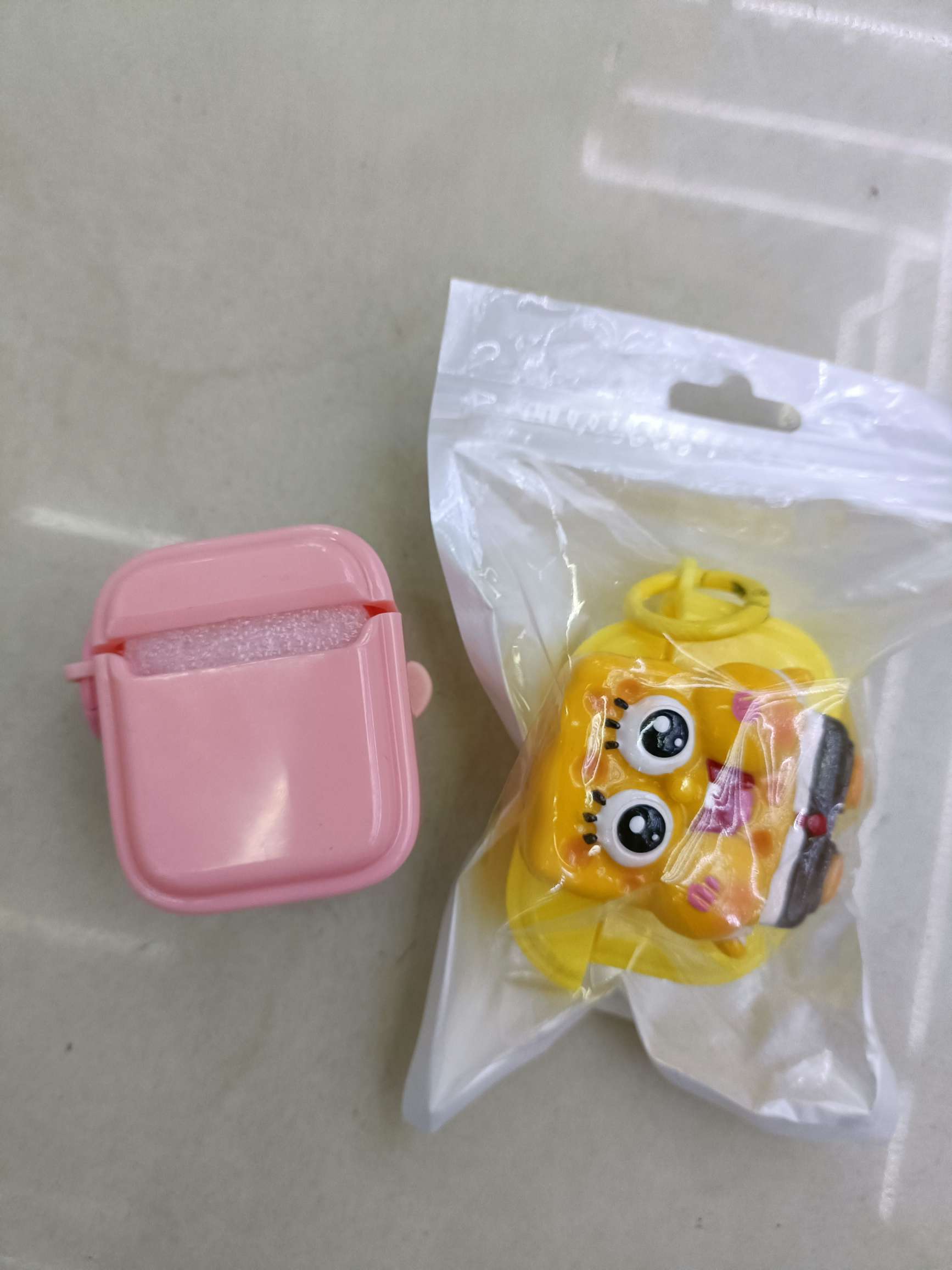The soft shell of the Bluetooth headset case is pasted with cartoon dolls detail image 2