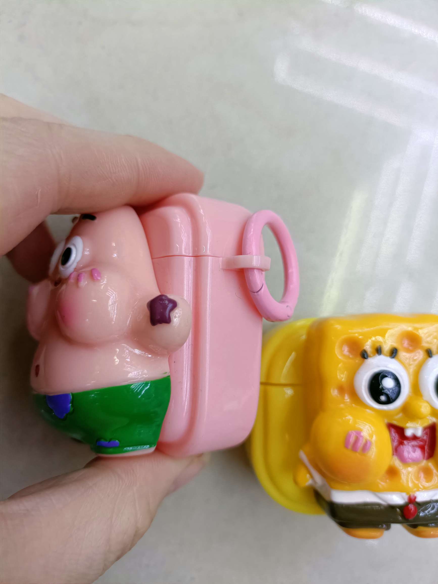 The soft shell of the Bluetooth headset case is pasted with cartoon dolls detail image 5