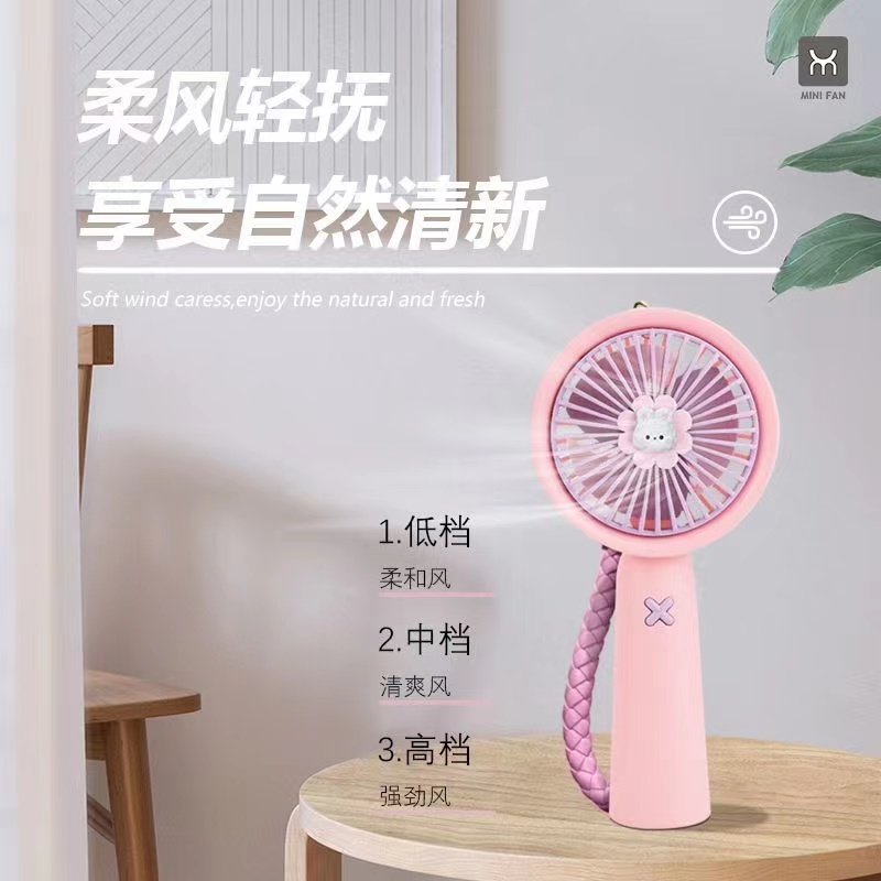 A popular cartoon keychain mini fan with USB charging, a portable handheld student fan with strong wind force for going out Application Scenario