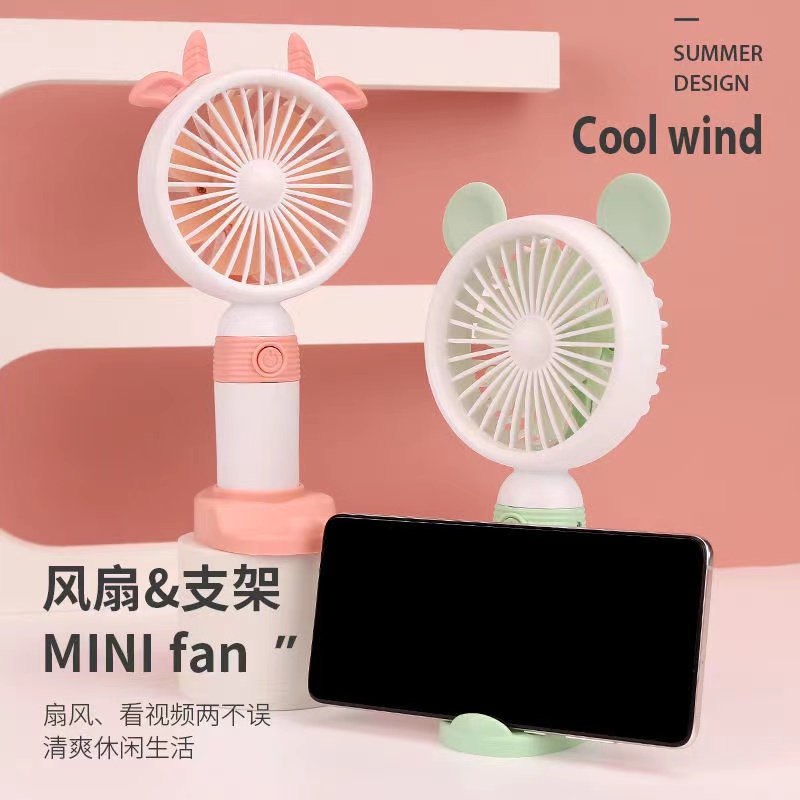 Creative cartoon USB handheld desktop charging mini fan for children and students, outdoor portable stand mini fan Application Scenario