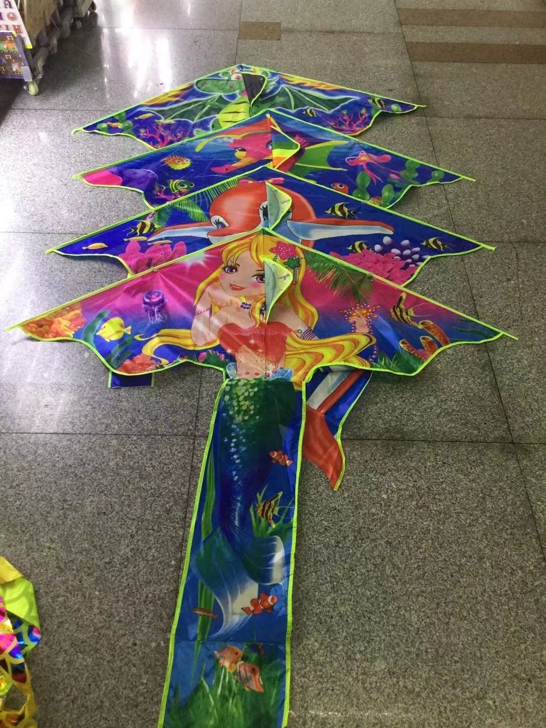 Heat transfer printed sequin seahorse mermaid kites are bright in color, easy to fly and sell well. Factory wholesale