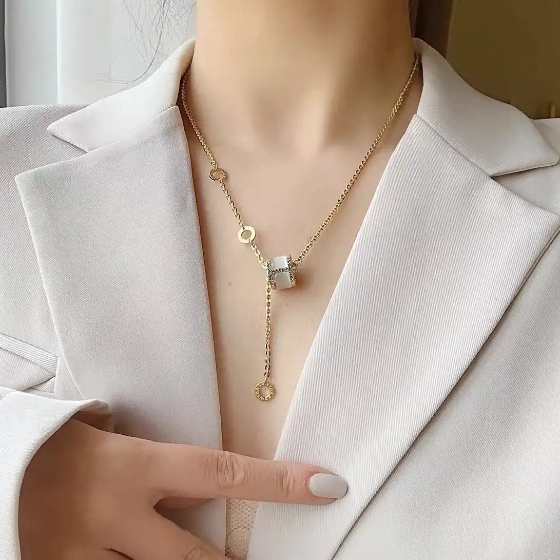 Hollowed-out four-leaf clover pendant necklace, collarbone chain, stud earrings, stainless steel seven-color chain wholesale 165