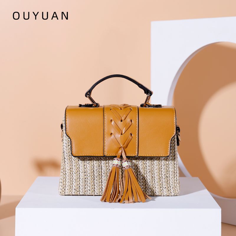 流苏编织女士斜跨包/春夏新款/PP草编盒子包白底实物图