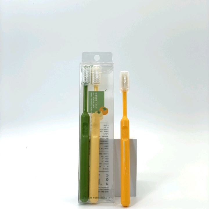 Three soft-bristled adult household toothbrushes with fresh covers for daily cleaning and care in a box